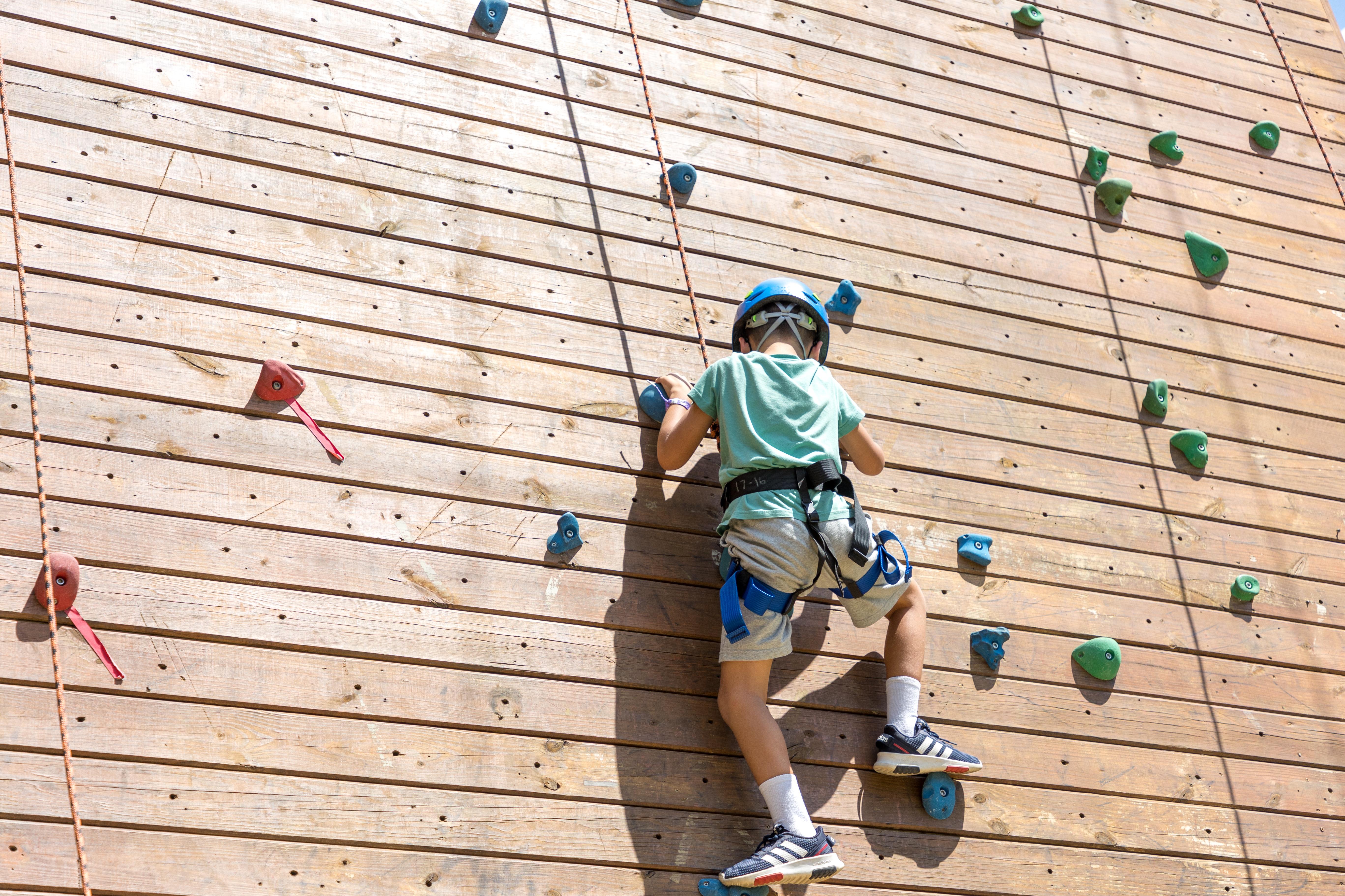 kid climbing wall