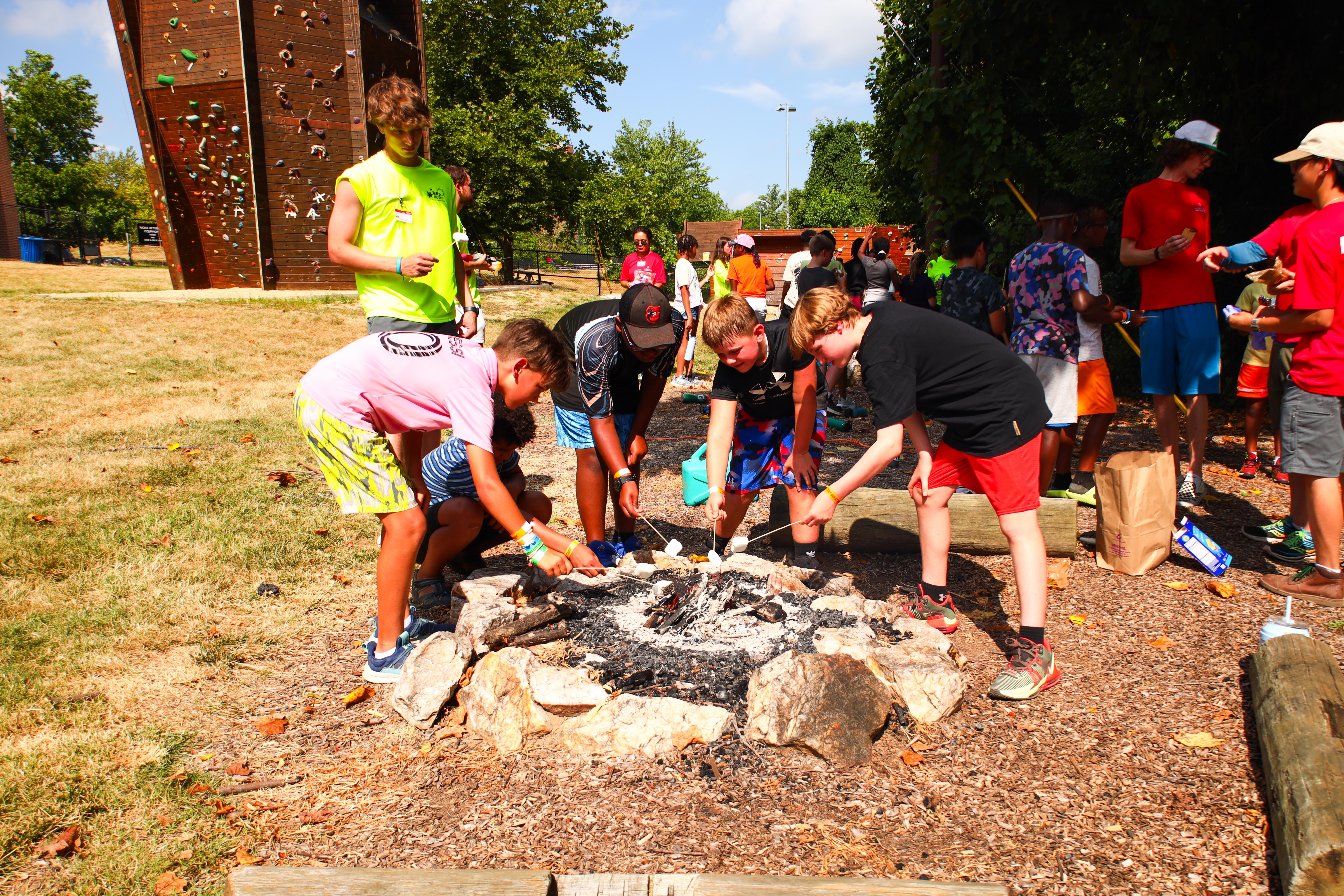 Many campers around the campfire